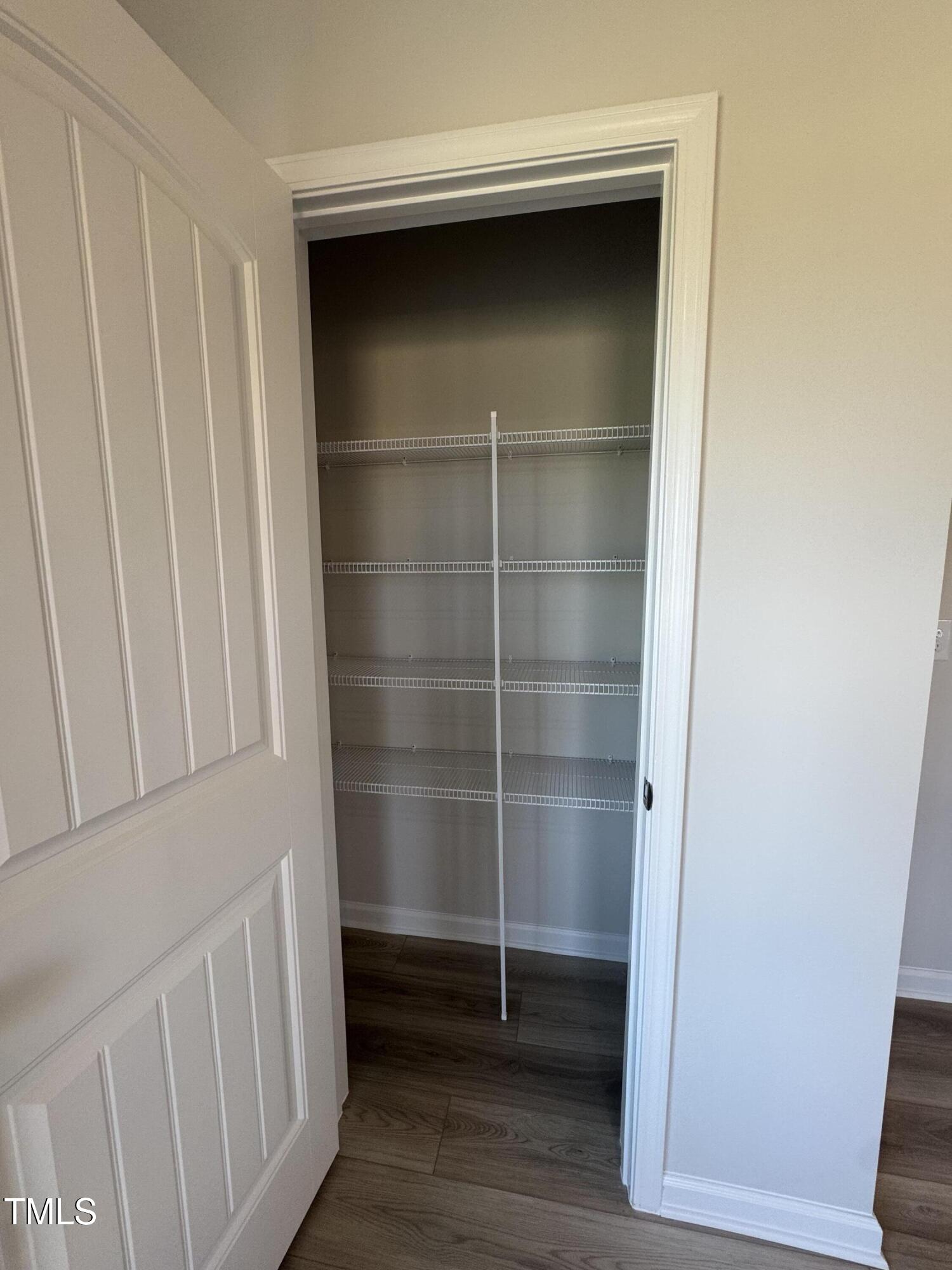 176 Bruce Drive Dunn, NC 28334 - Photo 11 of 30 a view of wooden walk in closet