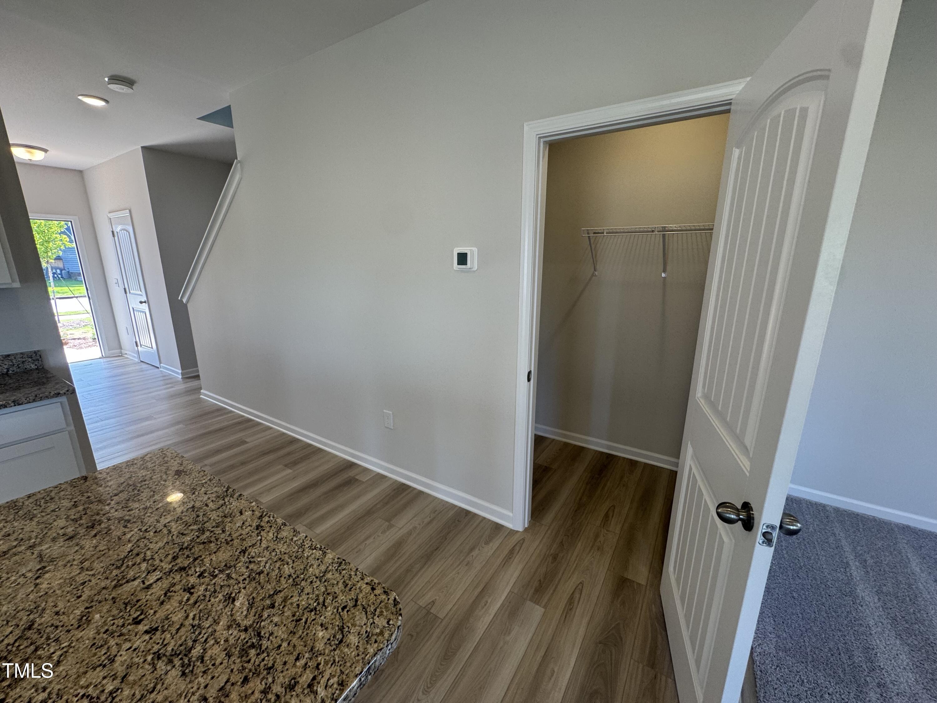 176 Bruce Drive Dunn, NC 28334 - Photo 13 of 30 wooden floor in an empty room with a window