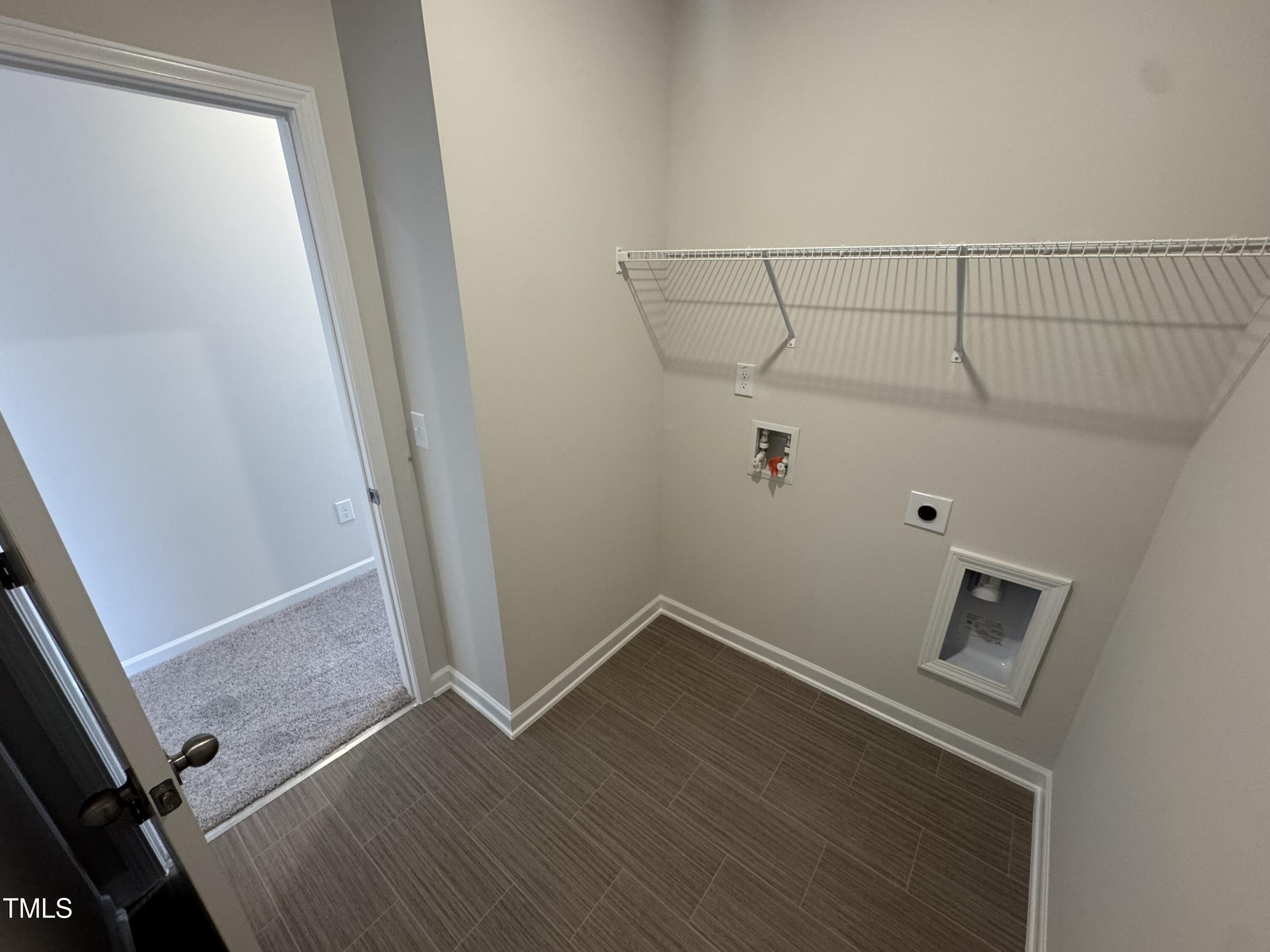176 Bruce Drive Dunn, NC 28334 - Photo 18 of 30 an empty room with wooden floor and white walls