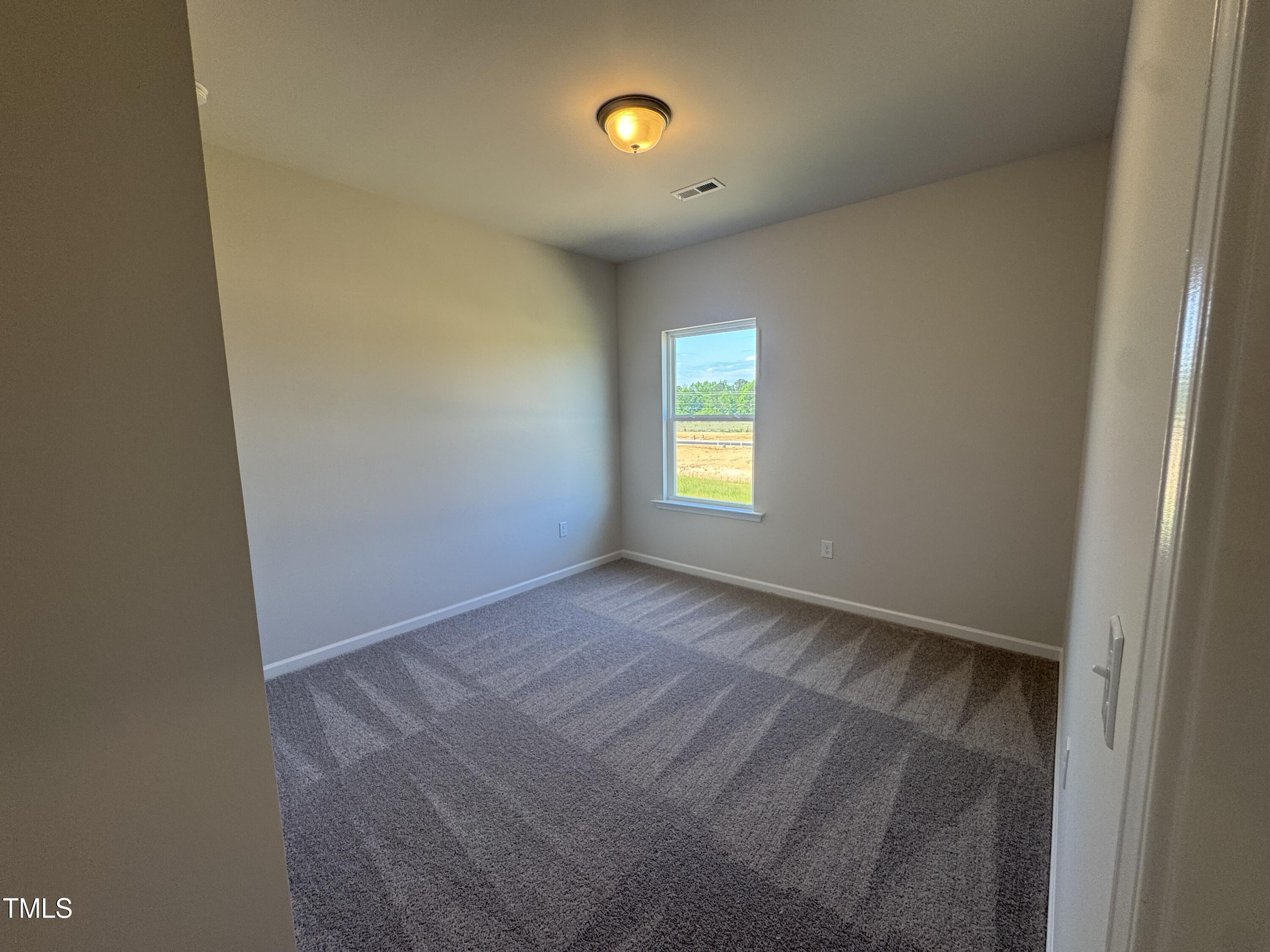 176 Bruce Drive Dunn, NC 28334 - Photo 19 of 30 a view of an empty room with a window