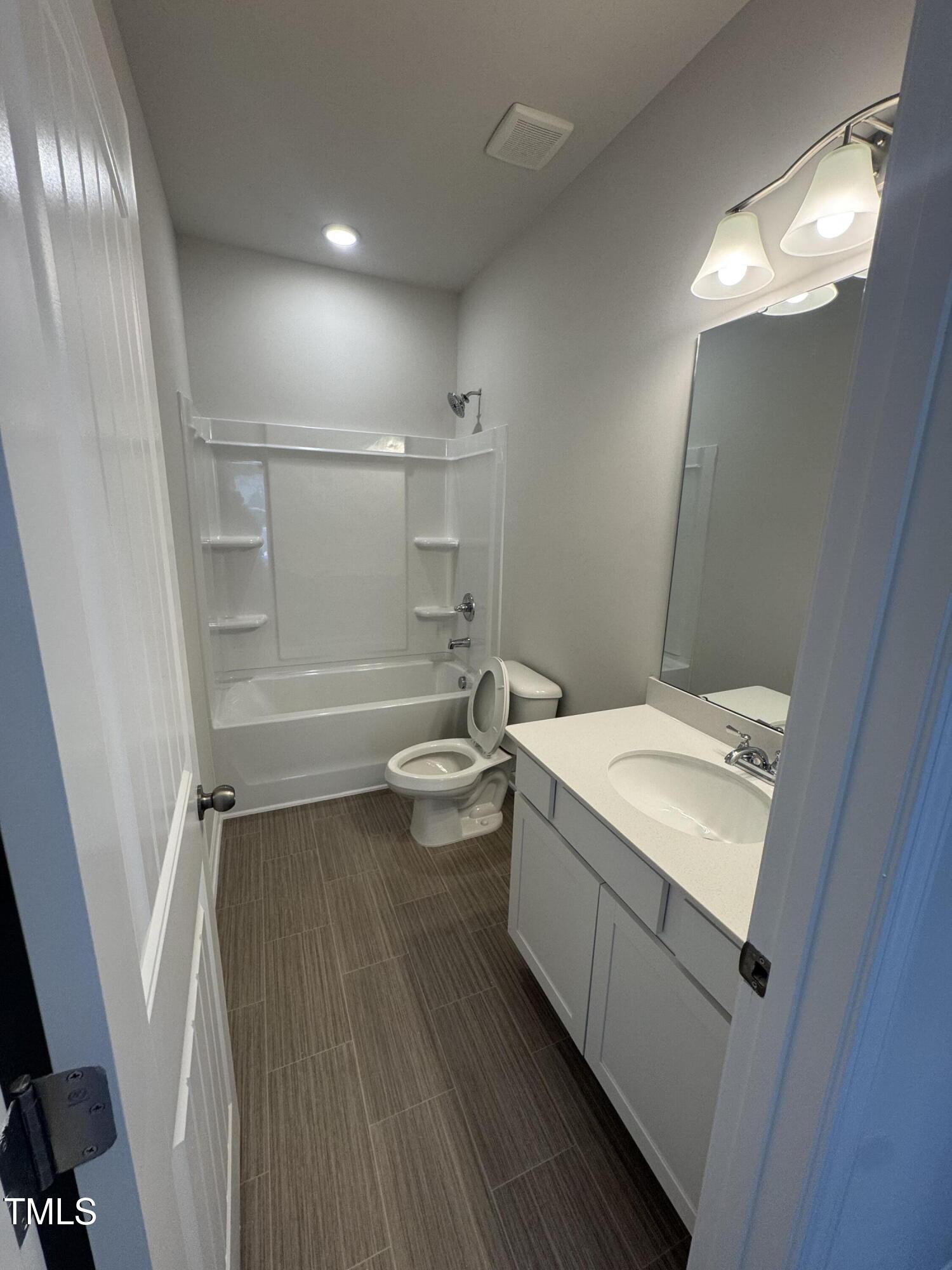 176 Bruce Drive Dunn, NC 28334 - Photo 20 of 30 a bathroom with a sink a toilet and shower