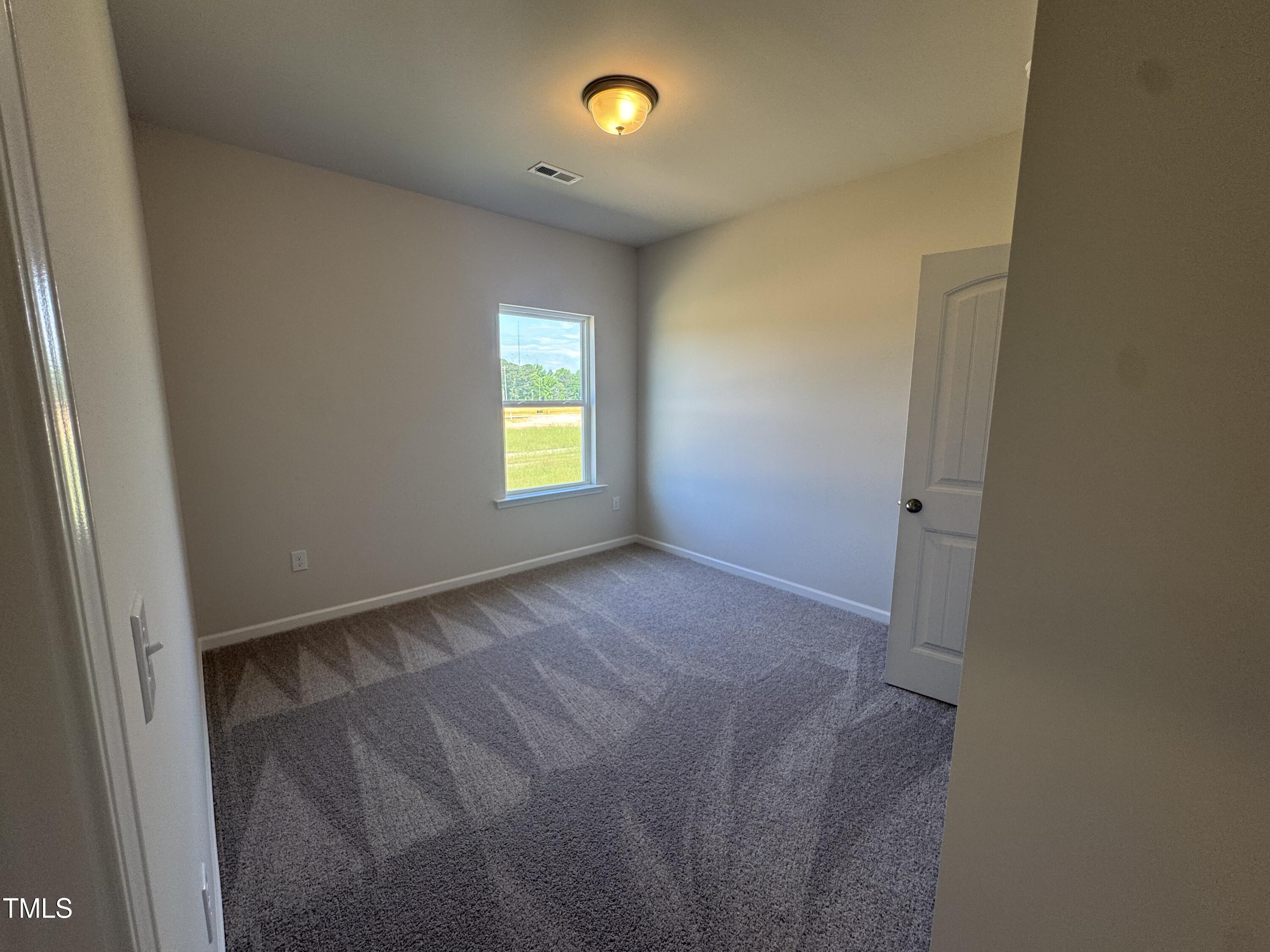 176 Bruce Drive Dunn, NC 28334 - Photo 21 of 30 a view of an empty room with a window
