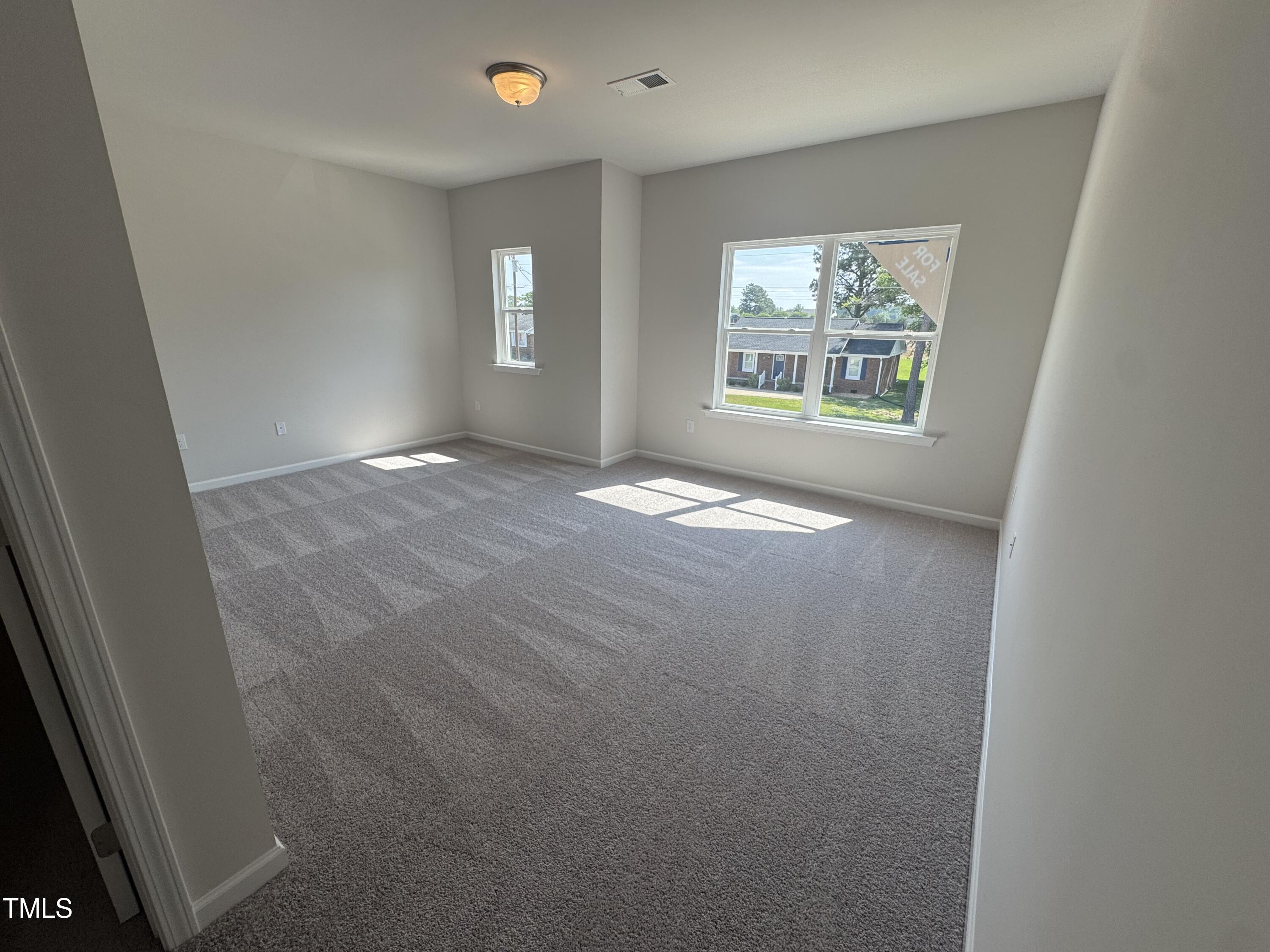 176 Bruce Drive Dunn, NC 28334 - Photo 25 of 30 an empty room with windows