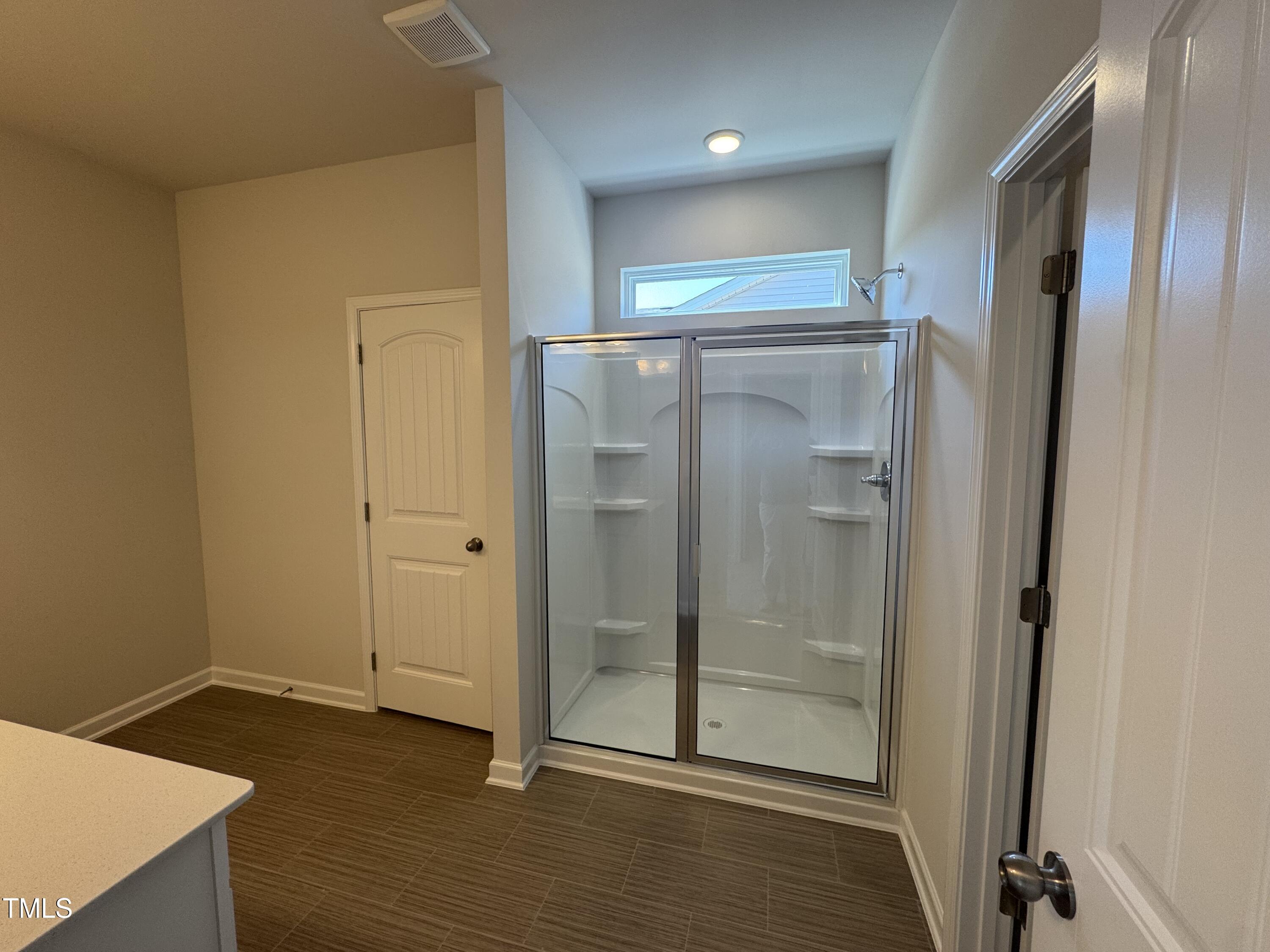 176 Bruce Drive Dunn, NC 28334 - Photo 27 of 30 a bathroom with a shower and a glass door