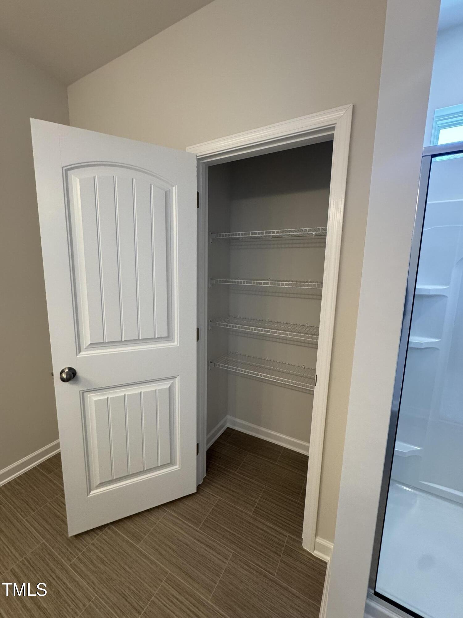 176 Bruce Drive Dunn, NC 28334 - Photo 28 of 30 a view of a hallway with wooden floor