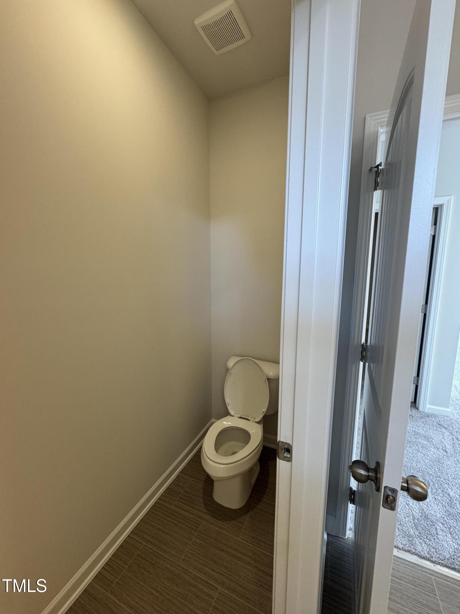 176 Bruce Drive Dunn, NC 28334 - Photo 30 of 30 a bathroom with a toilet