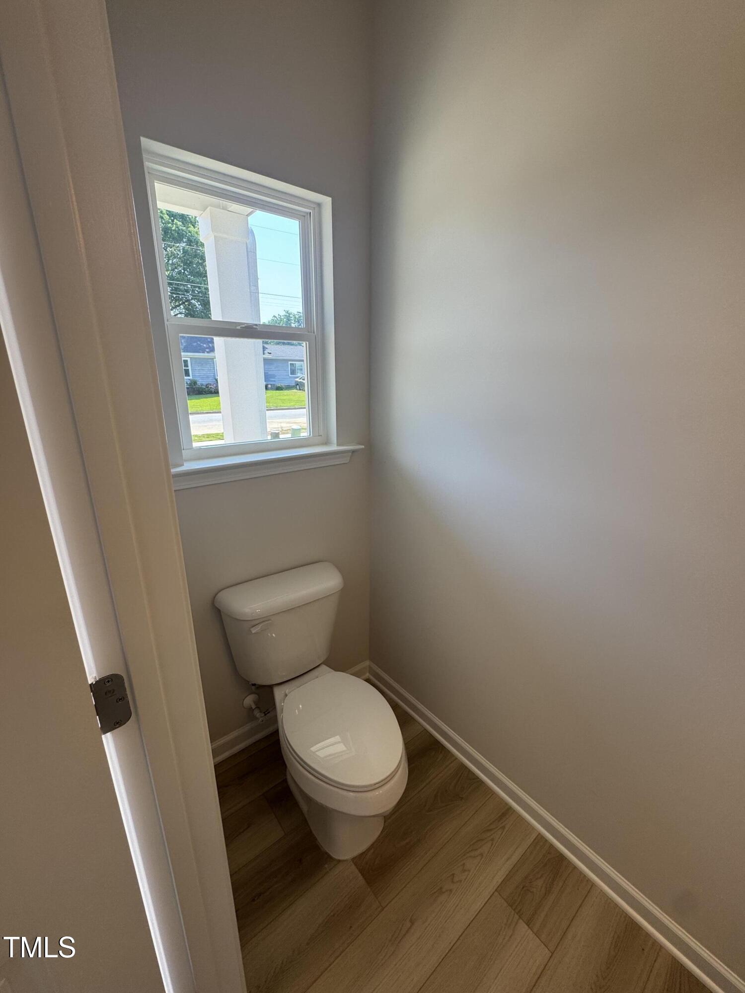 176 Bruce Drive Dunn, NC 28334 - Photo 4 of 30 a white toilet sitting next to a window