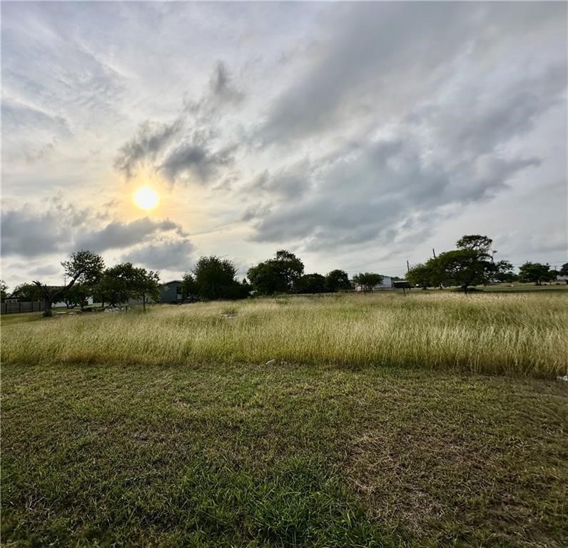 509 1st Street Bayside, TX 78340 - Photo 3 of 6 a view of a lake from a yard