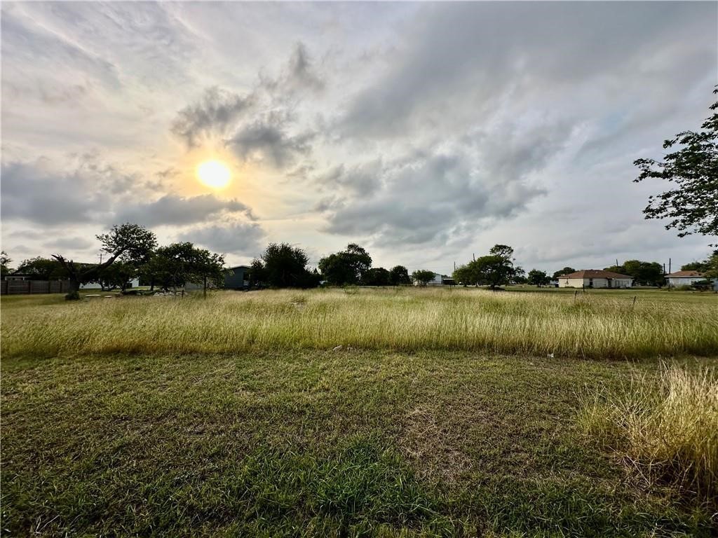 509 1st Street Bayside, TX 78340 - Photo 4 of 6 a view of a lake from a yard