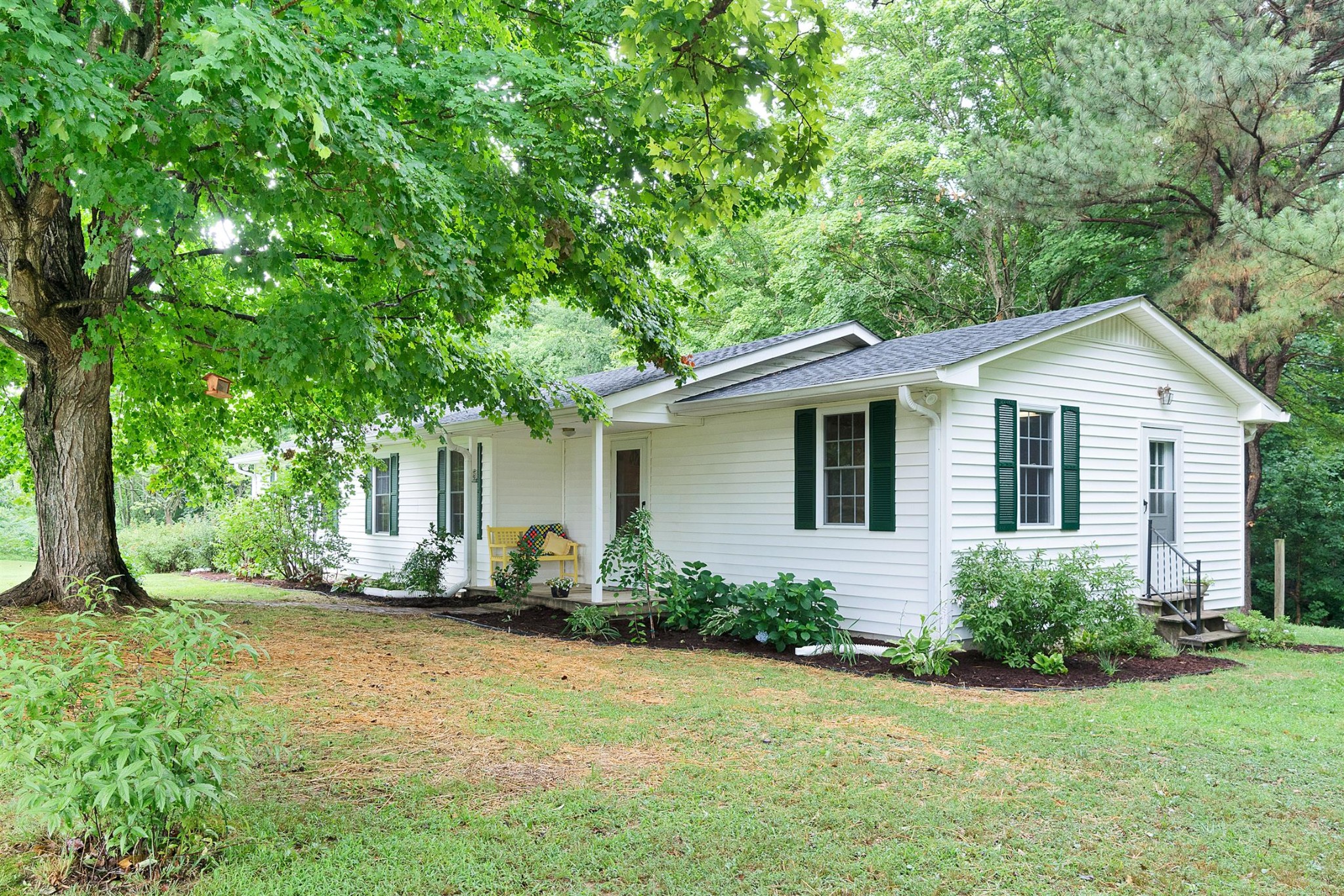 1074 A North Corinth Road Portland, TN 37148 - Photo 1 of 25 a view of a house with backyard and garden