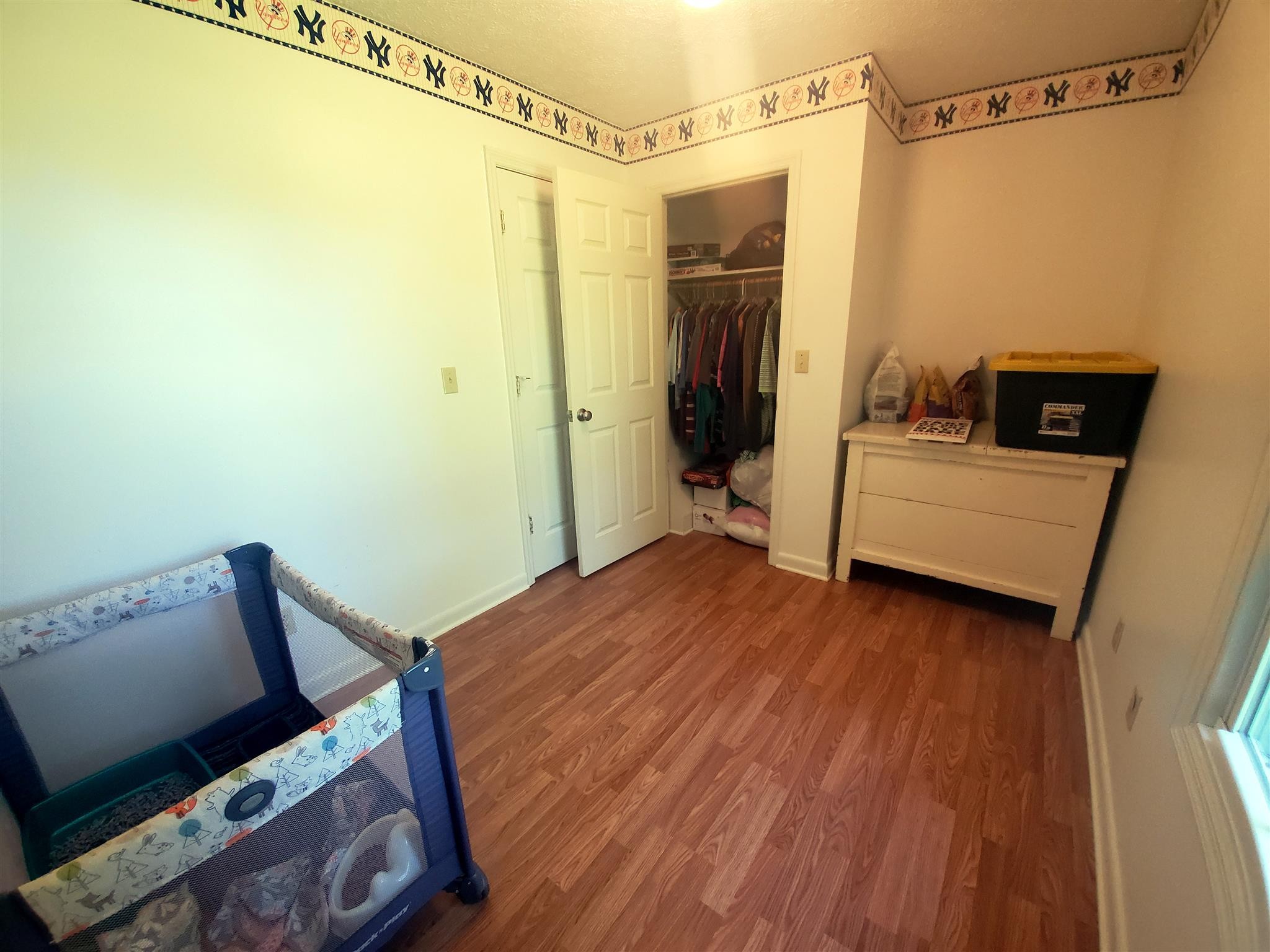 1074 A North Corinth Road Portland, TN 37148 - Photo 20 of 25 a bedroom with a bed and a flat tv screen on the table