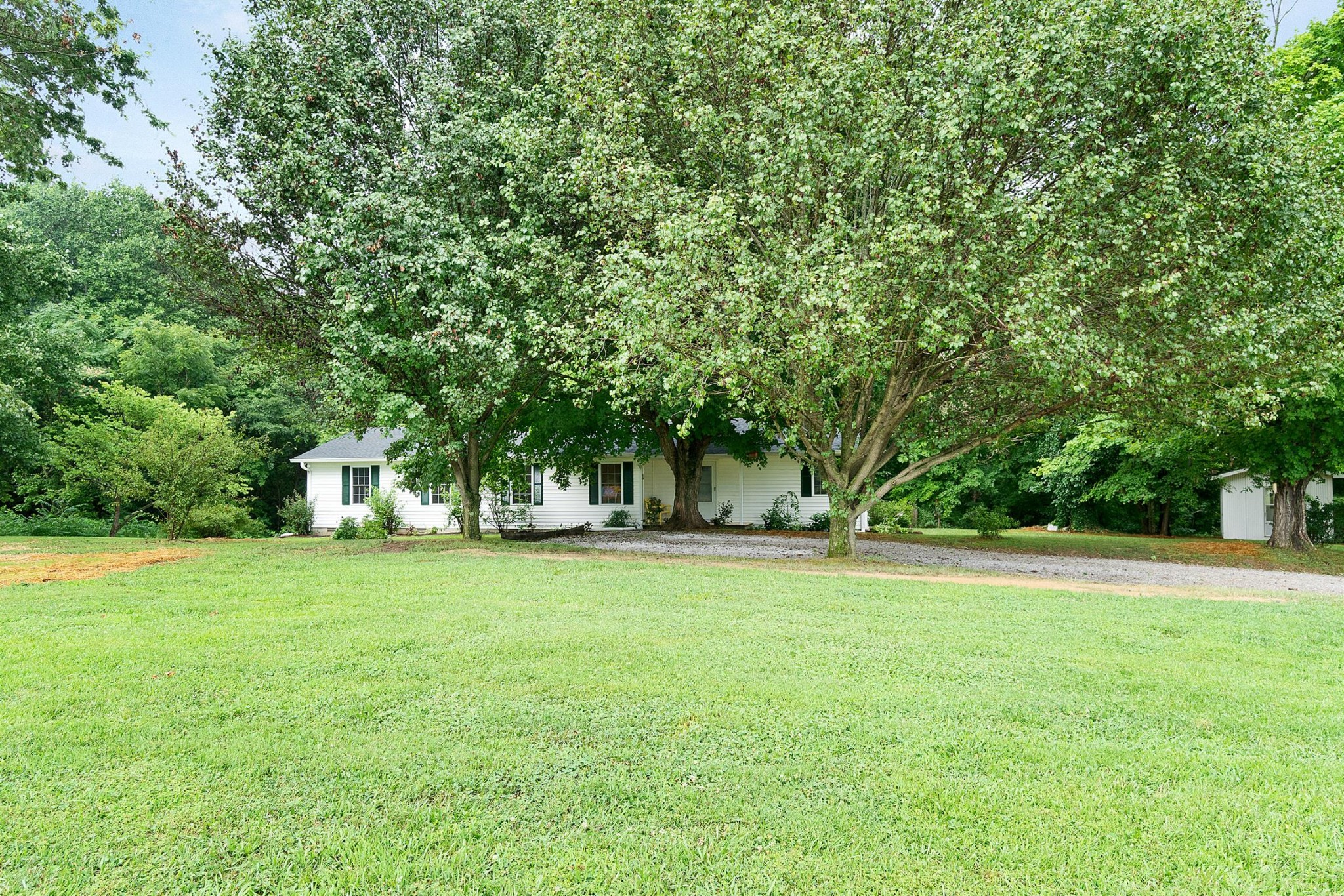 1074 A North Corinth Road Portland, TN 37148 - Photo 3 of 25 a house with a trees in the background