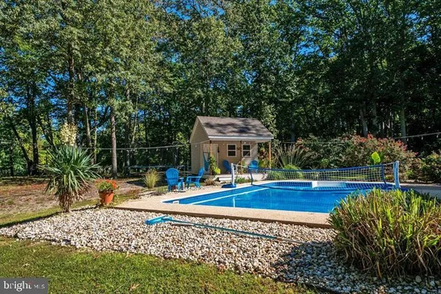 a view of a swimming pool with a patio