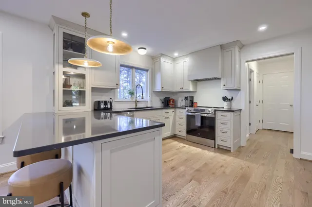 a kitchen with a refrigerator and a table