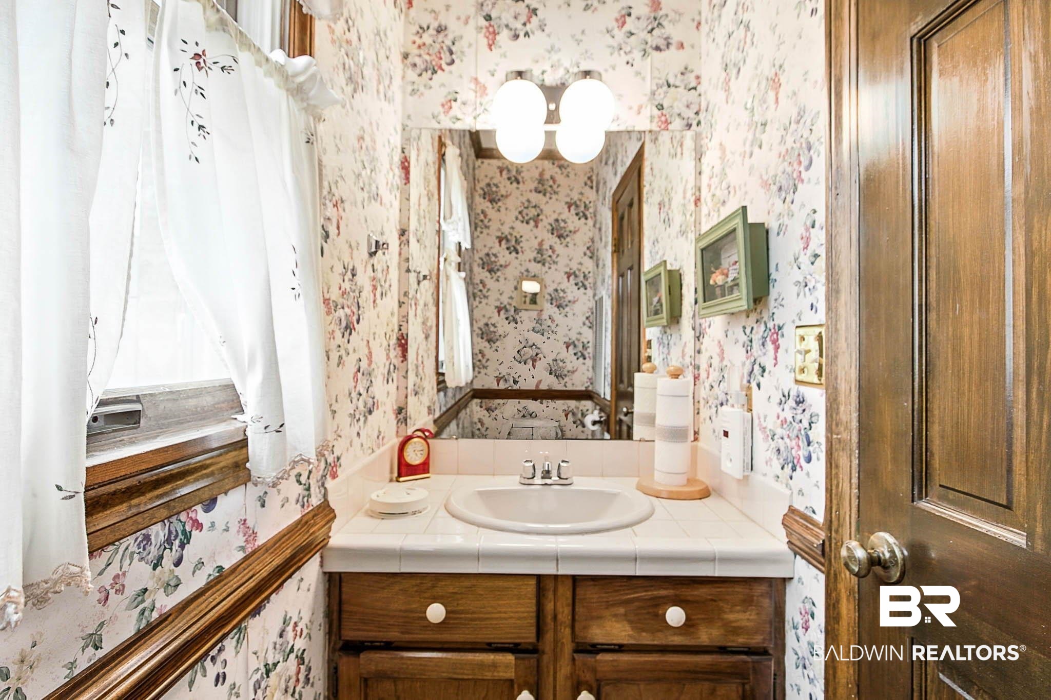 17270 Davis Road Summerdale, AL 36580 - Photo 31 of 97 Bathroom with wallpapered walls and vanity