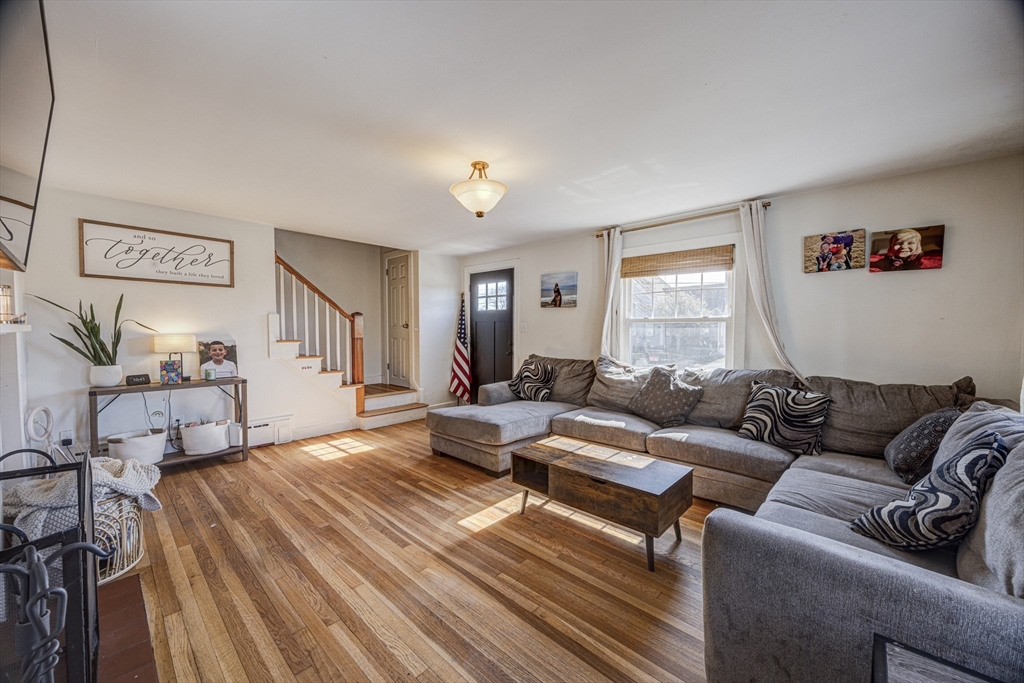 707 Hathaway Road New Bedford, MA 02740 - Photo 11 of 33 a living room with furniture and a wooden floor
