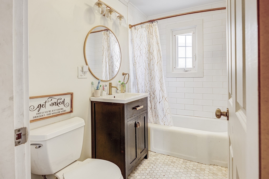 707 Hathaway Road New Bedford, MA 02740 - Photo 14 of 33 a bathroom with a sink toilet and shower