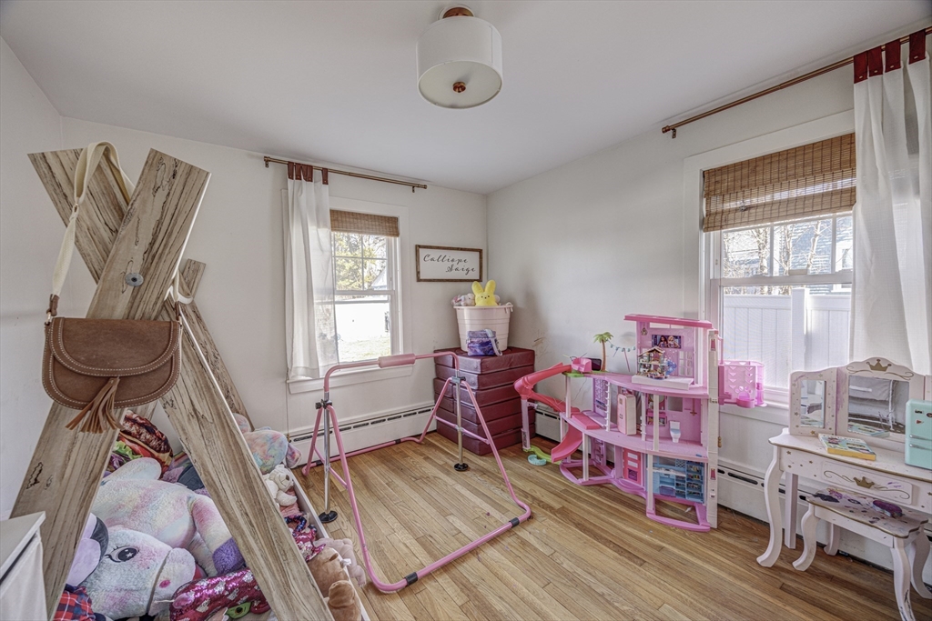 707 Hathaway Road New Bedford, MA 02740 - Photo 15 of 33 a living room with lots of furniture and a wooden floor