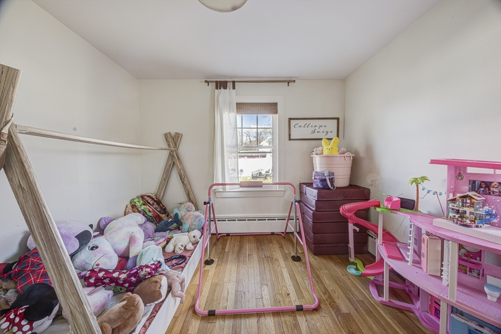 707 Hathaway Road New Bedford, MA 02740 - Photo 16 of 33 a living room with furniture and a wooden floor