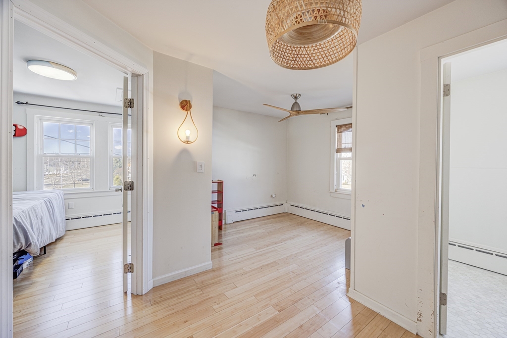 707 Hathaway Road New Bedford, MA 02740 - Photo 21 of 33 a view of empty room with wooden floor