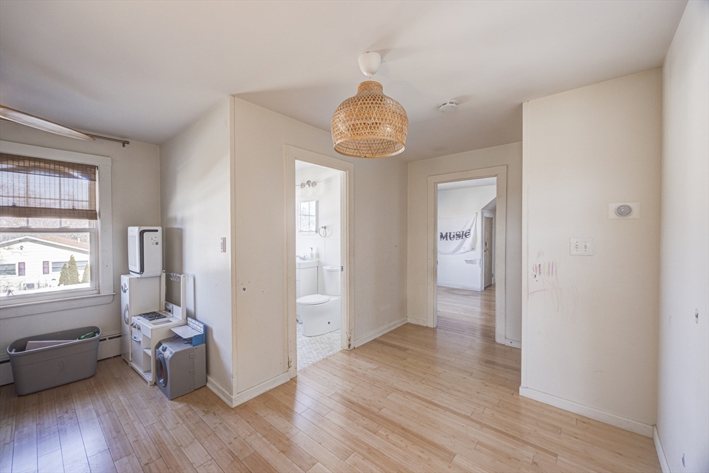 707 Hathaway Road New Bedford, MA 02740 - Photo 22 of 33 wooden floor in an empty room with a window