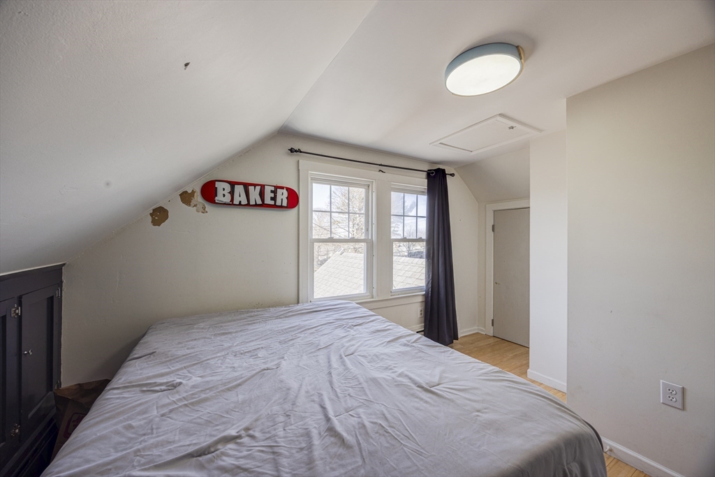 707 Hathaway Road New Bedford, MA 02740 - Photo 29 of 33 a bedroom with a bed and a window
