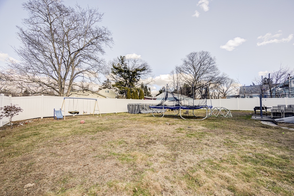 707 Hathaway Road New Bedford, MA 02740 - Photo 32 of 33 a view of yard with swimming pool and trees