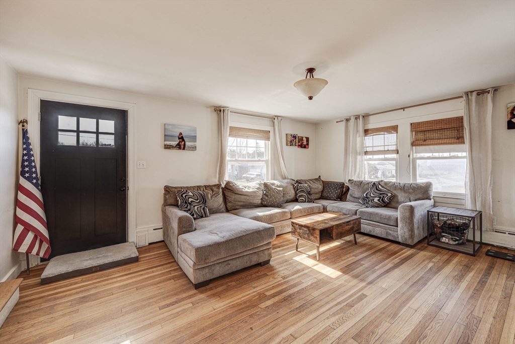 707 Hathaway Road New Bedford, MA 02740 - Photo 9 of 33 a living room with furniture and a large window