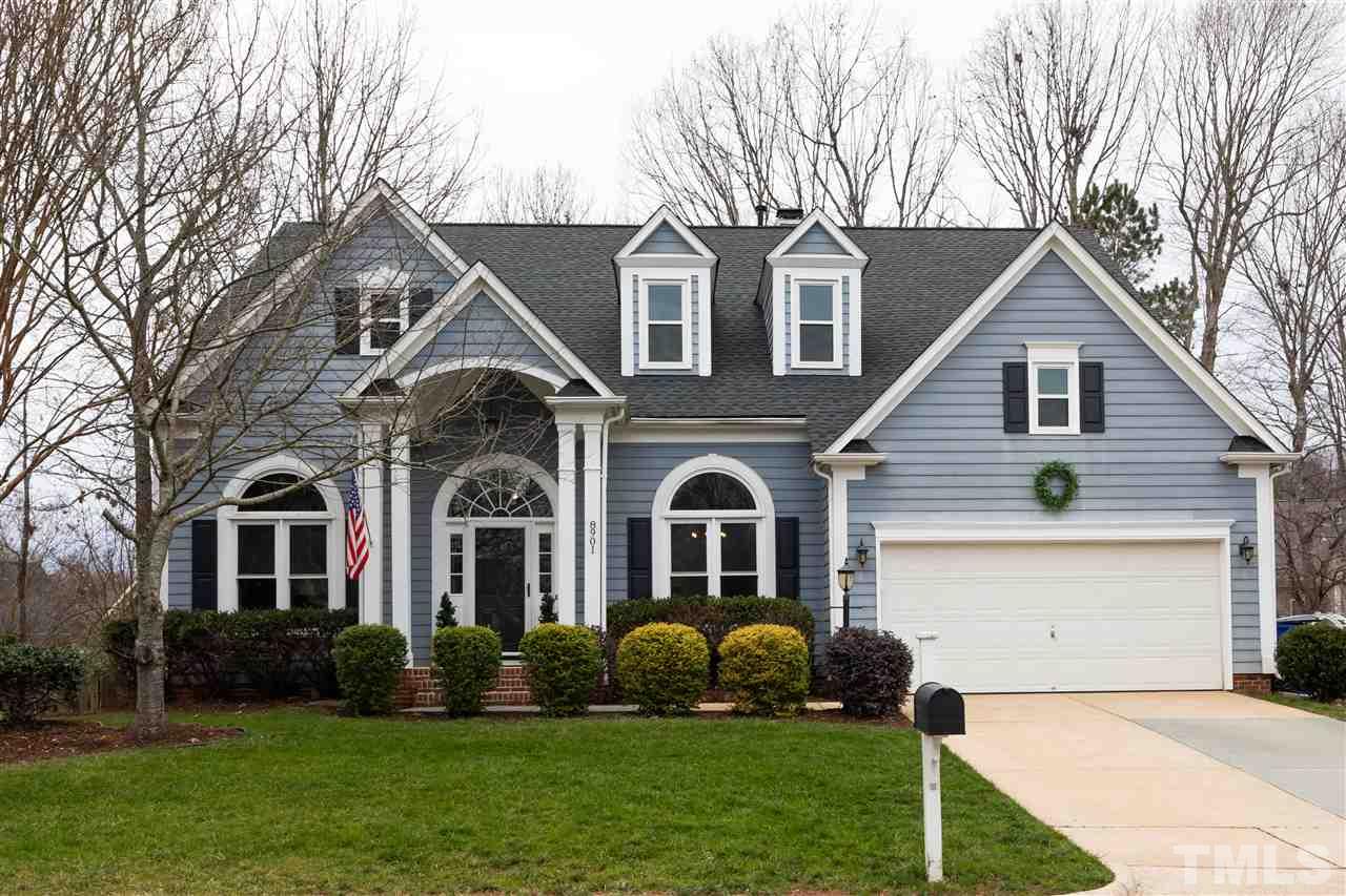 8901 Breeland Way Raleigh, NC 27613 - Photo 1 of 24 a front view of a house with a garden and yard