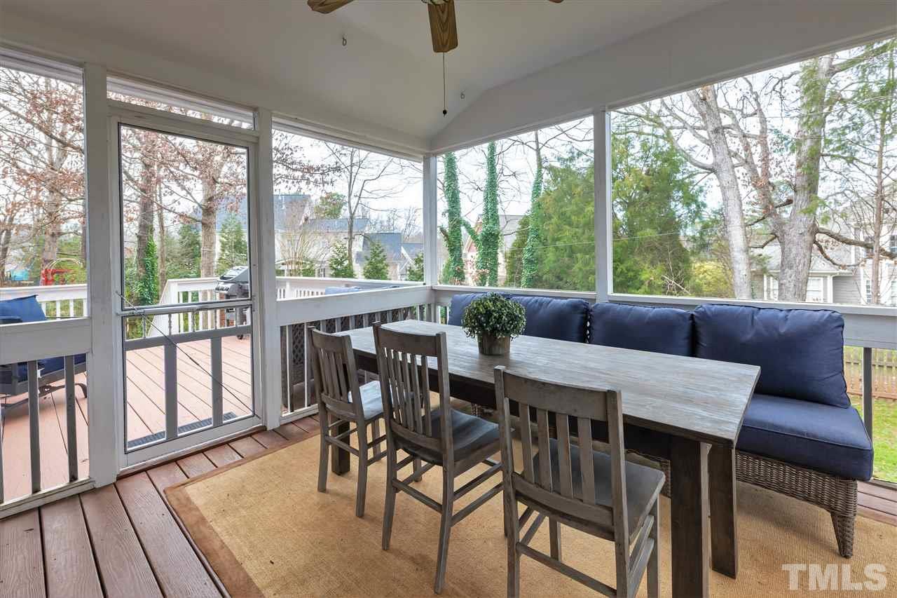 8901 Breeland Way Raleigh, NC 27613 - Photo 21 of 24 a view of a dining room with furniture window and wooden floor