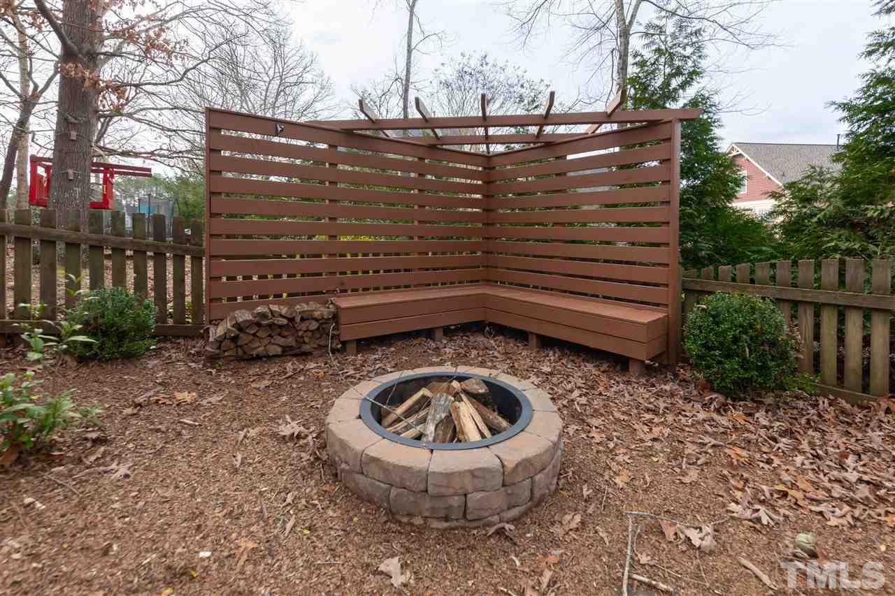 8901 Breeland Way Raleigh, NC 27613 - Photo 23 of 24 a view of fountain and wooden fence