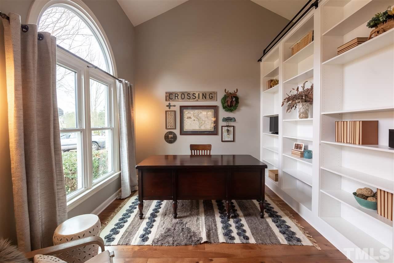 8901 Breeland Way Raleigh, NC 27613 - Photo 8 of 24 a living room with furniture and a large window