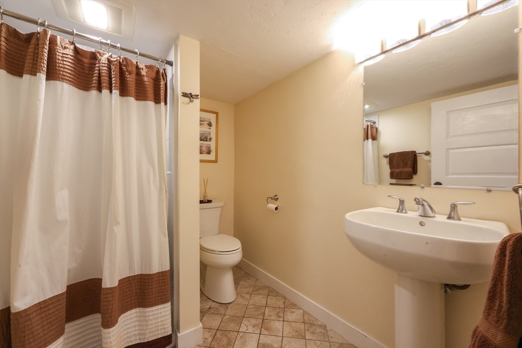 58 Pine Hill Road Southborough, MA 01772 - Photo 15 of 42 a bathroom with a sink toilet and shower