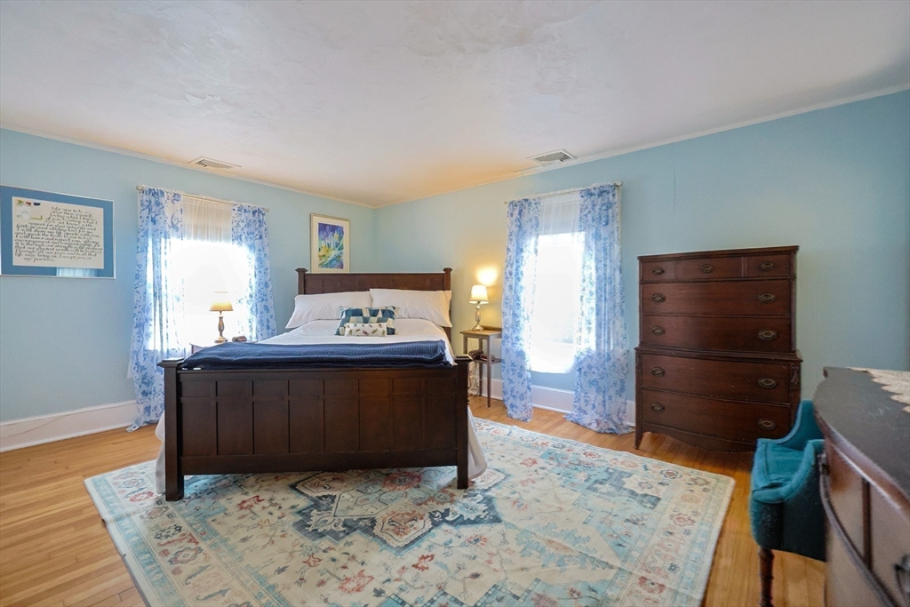 58 Pine Hill Road Southborough, MA 01772 - Photo 30 of 42 a view of a bedroom with furniture and wooden floor