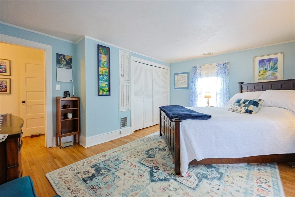 58 Pine Hill Road Southborough, MA 01772 - Photo 31 of 42 a bedroom with furniture and a wooden floor