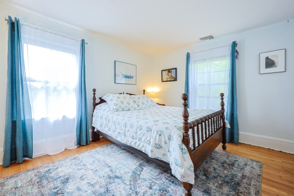 58 Pine Hill Road Southborough, MA 01772 - Photo 35 of 42 a bedroom with a bed and wooden floor