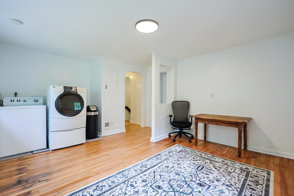 58 Pine Hill Road Southborough, MA 01772 - Photo 37 of 42 a bedroom with a bed and a chair