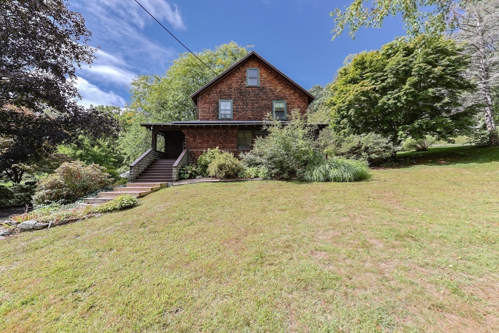 58 Pine Hill Road Southborough, MA 01772 - Photo 4 of 42 a front view of a house with a yard