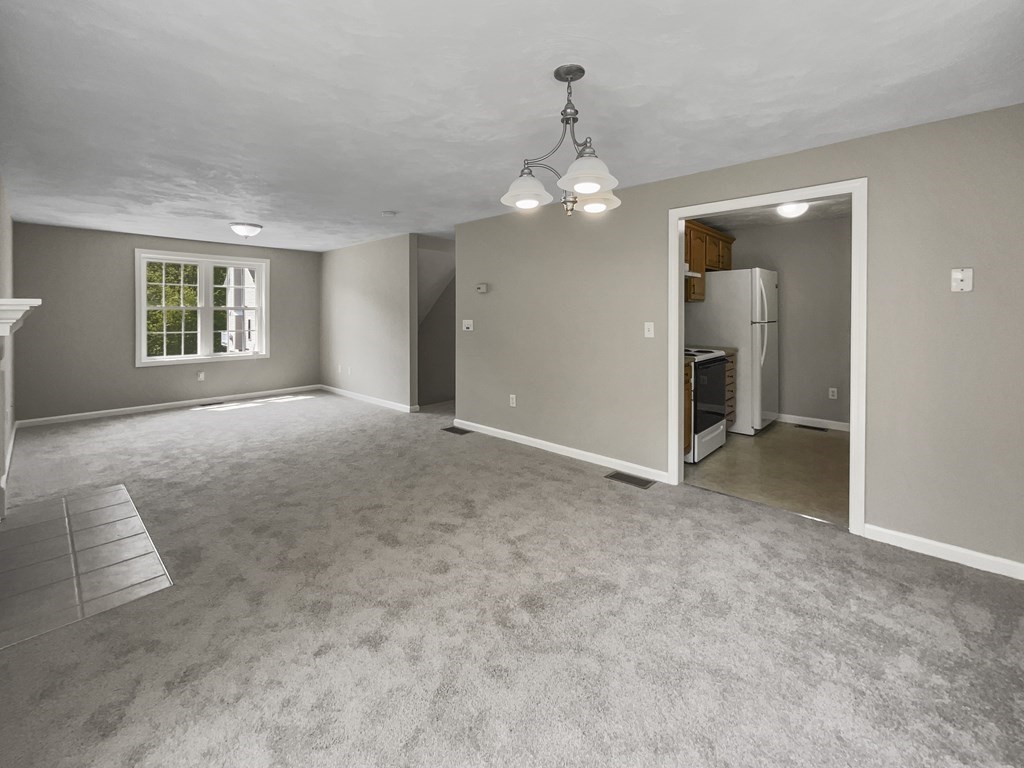 24 Sophia Drive Worcester, MA 01607 - Photo 12 of 30 an empty room with windows and chandelier