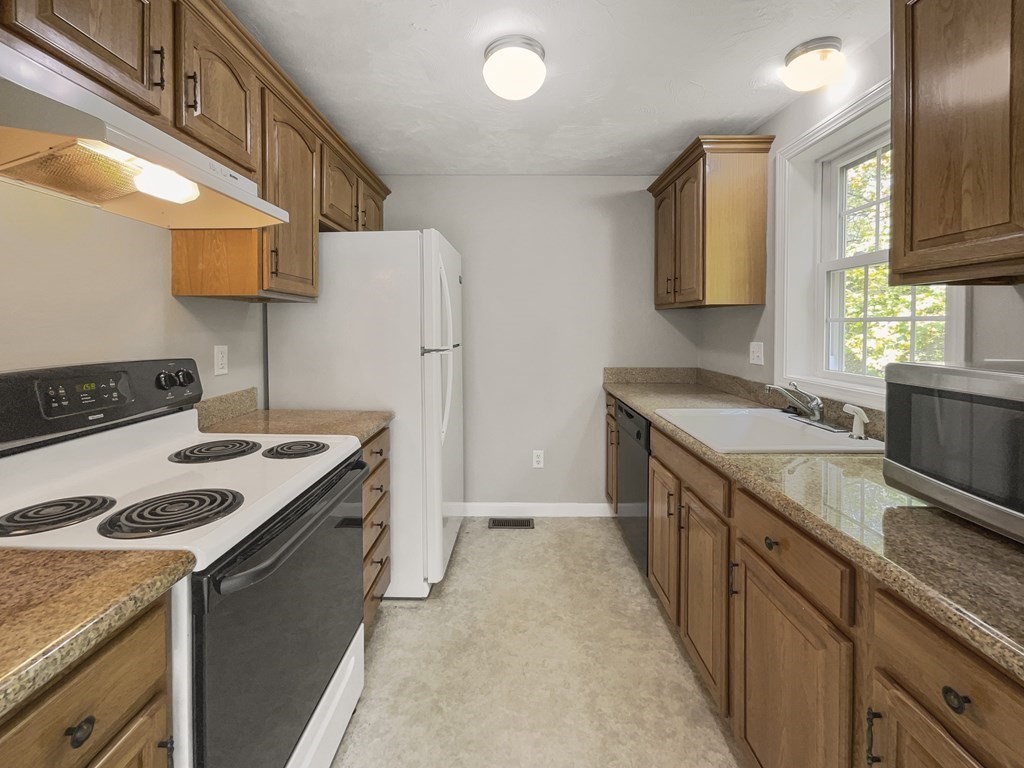 24 Sophia Drive Worcester, MA 01607 - Photo 13 of 30 a kitchen with a stove and a sink
