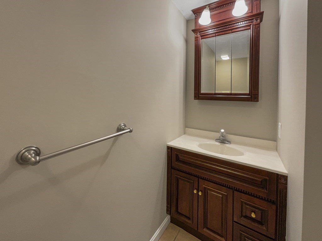 24 Sophia Drive Worcester, MA 01607 - Photo 16 of 30 a bathroom with a sink and a mirror
