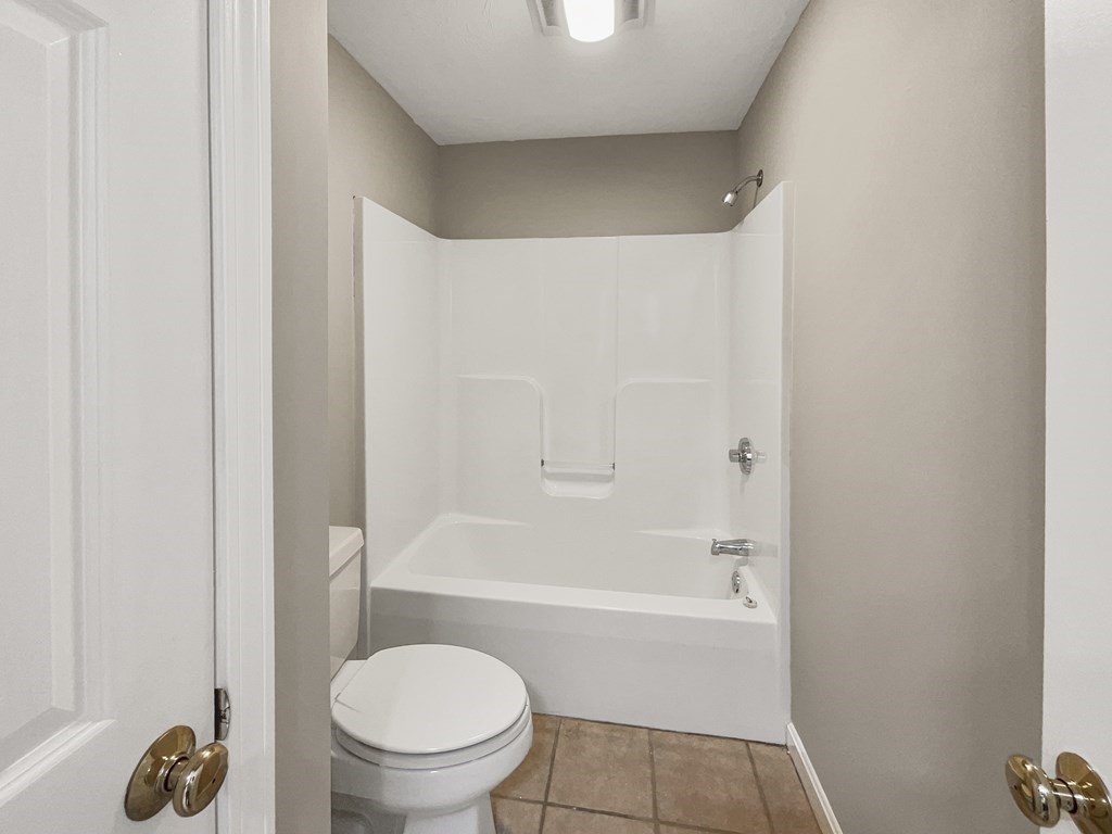 24 Sophia Drive Worcester, MA 01607 - Photo 20 of 30 a bathroom with a bathtub and a toilet