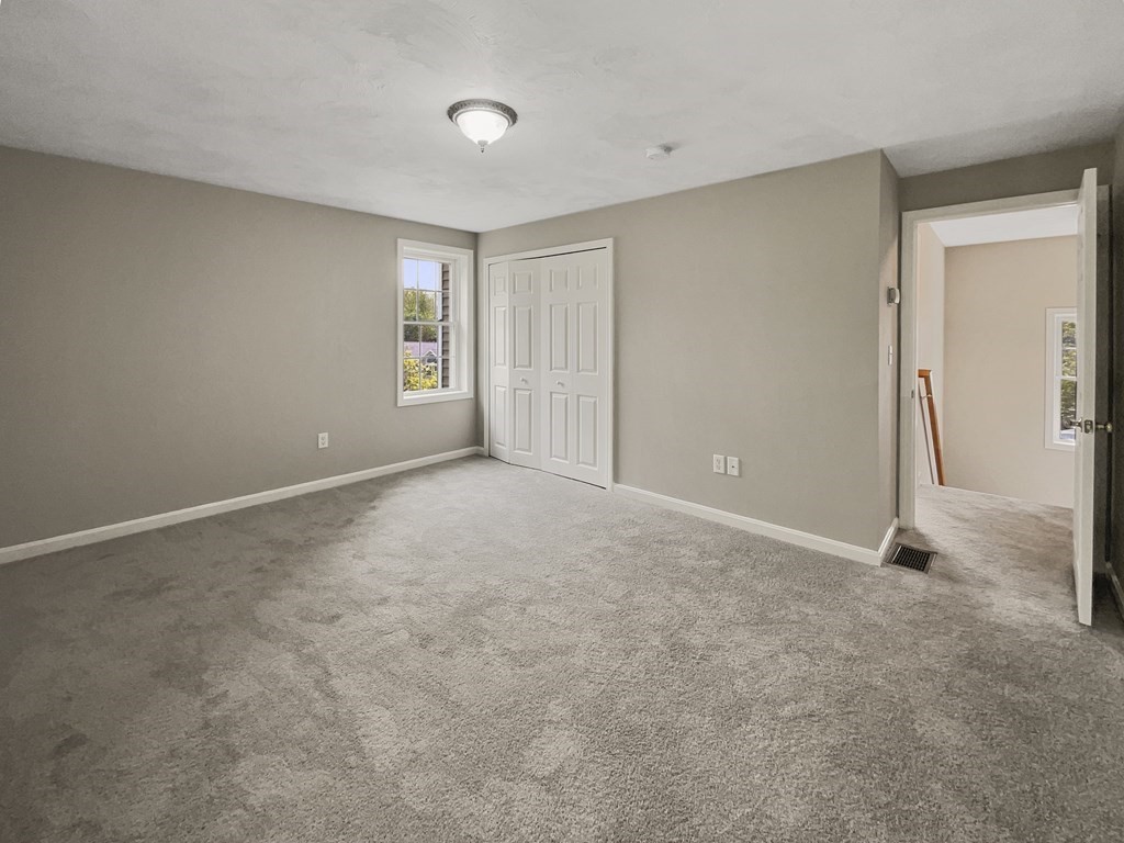 24 Sophia Drive Worcester, MA 01607 - Photo 21 of 30 a view of an empty room with closet and a window