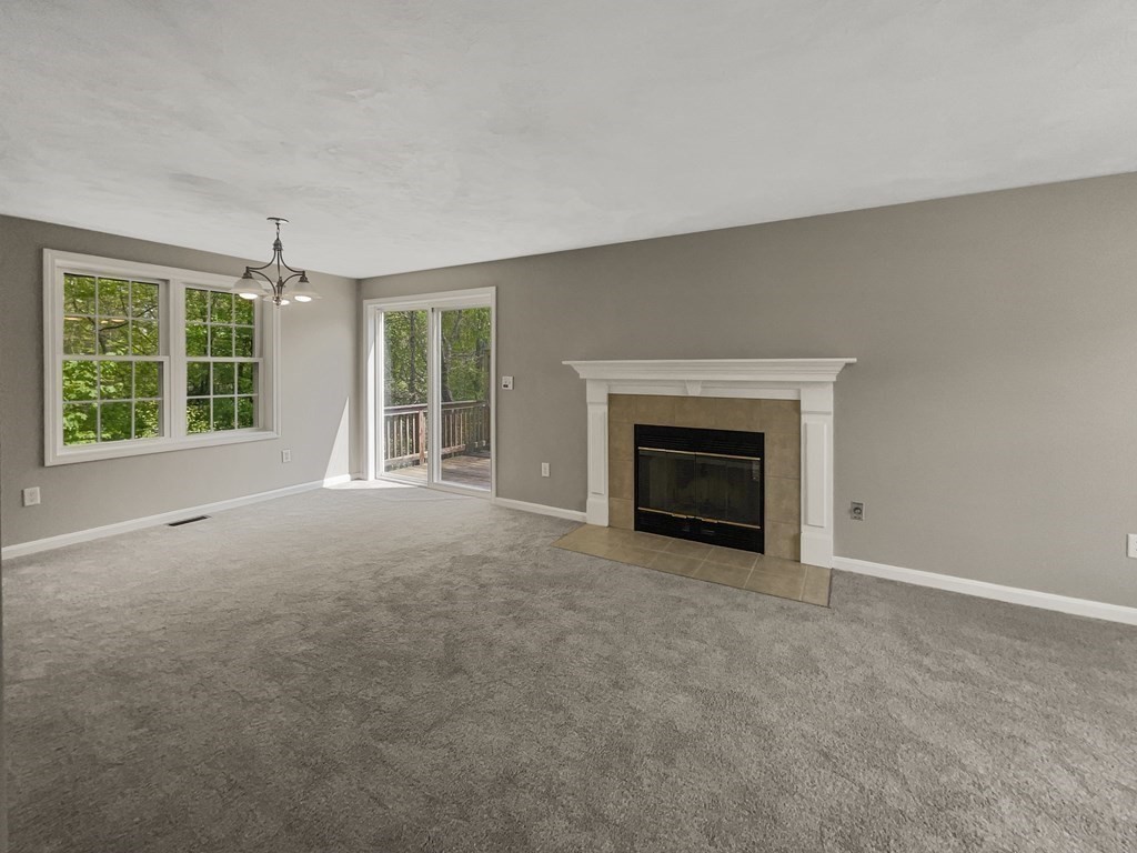 24 Sophia Drive Worcester, MA 01607 - Photo 3 of 30 an empty room with windows and fireplace