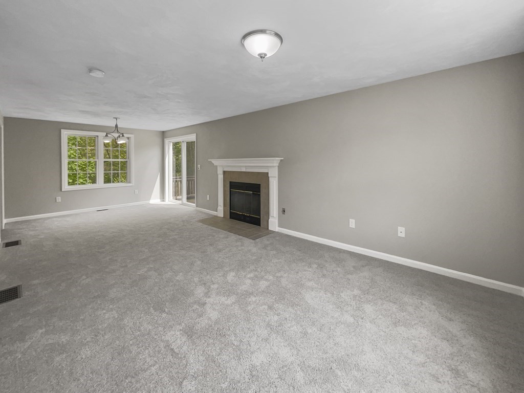 24 Sophia Drive Worcester, MA 01607 - Photo 10 of 30 an empty room with windows and fireplace