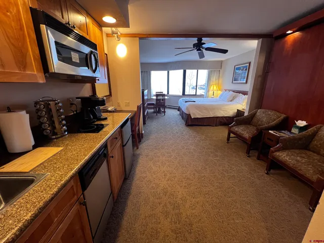 a lobby with furniture and window