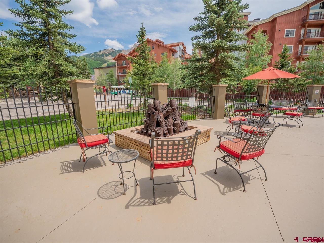 6 Emmons Road, Unit 521 Crested Butte, CO 81225 - Photo 7 of 19 a chair and tables in the city view