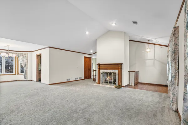 a view of empty room with fireplace