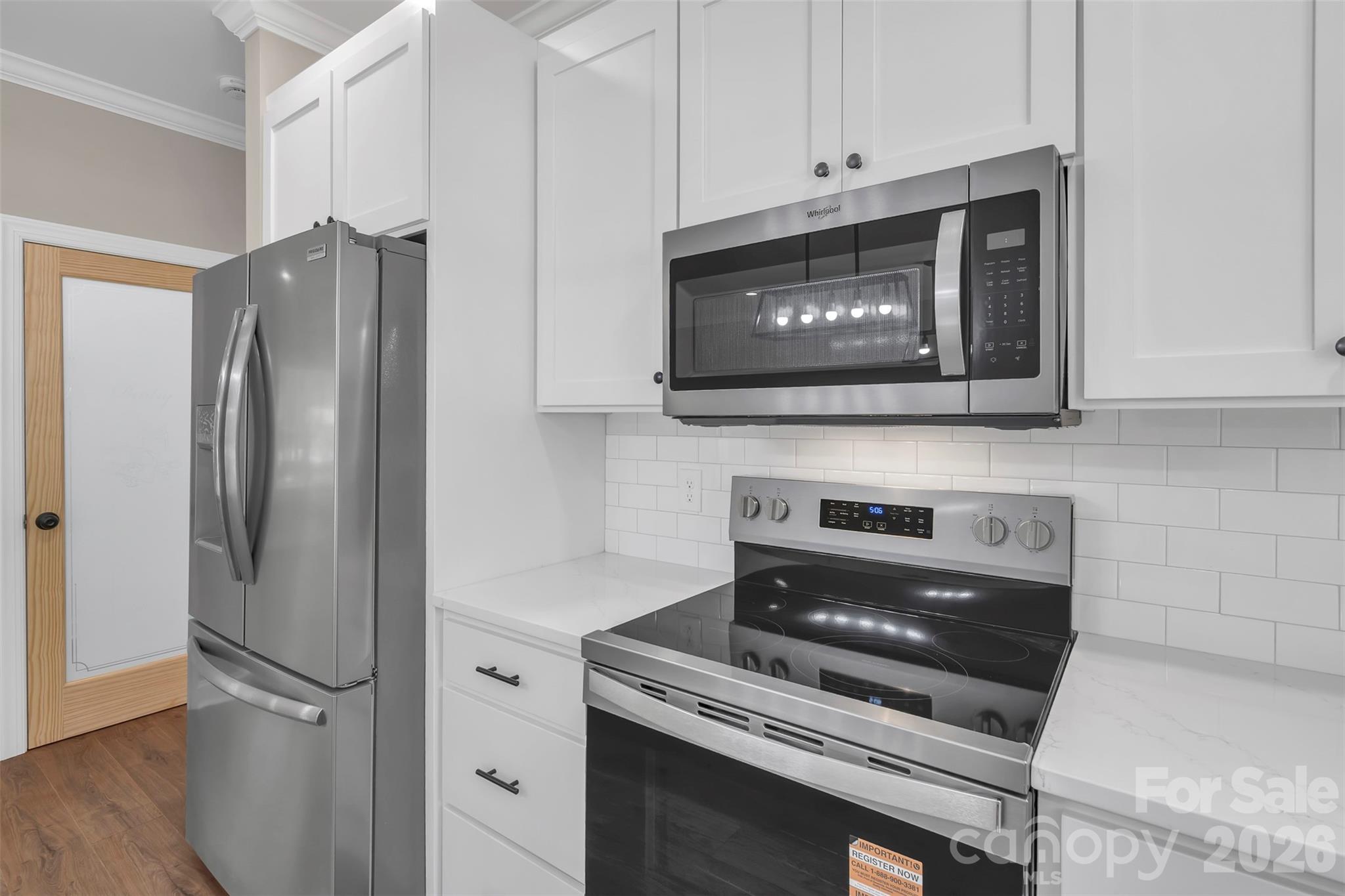 0 Cimmeron Road Lancaster, SC 29720 - Photo 13 of 29 a kitchen with stainless steel appliances white cabinets and a stove top oven