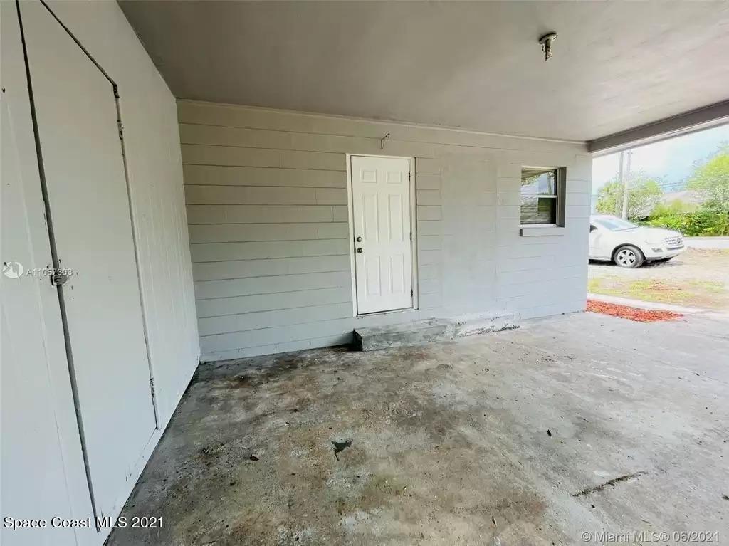2419 Clearlake Road Cocoa, FL 32922 - Photo 24 of 27 carport /side entrance / laundry room
